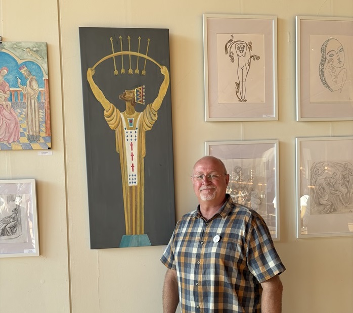 Cllr Ian Shipp with one of the St Edmund pieces by Valerii Kaluiev on display at The Apex Gallery