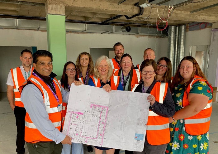 The second floor part of the education centre at Provincial House Haverhill will open in the autumn. Cllr Diane Hind and Indy Wijenayaka are pictured with representatives of the college and Mixbrow Construction