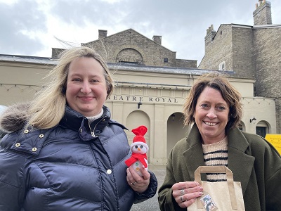 Cllr Jo Rayner and Michelle Freeman of Crafty Foxes with the snowman and activity pack outside the Theatre Royal in Bury St Edmunds1