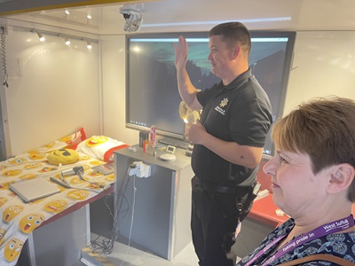 Retained firefighter Robert Sinclair and Cllr Donna Higgins at Crucial Crew. The session saw students taught about fire hazards in their home and what to do in a real life emergency.