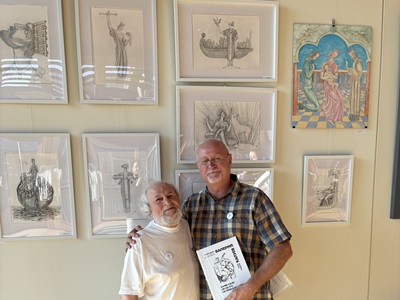 Artist Valerii Kaluiev with Cllr Ian Shipp at The Apex Gallery in Bury St Edmunds. Behind you can see some of his work inspired by St Edmund.