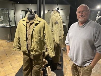 Cllr Ian Shipp with the outfit worn by George Clooney in The Monuments Men